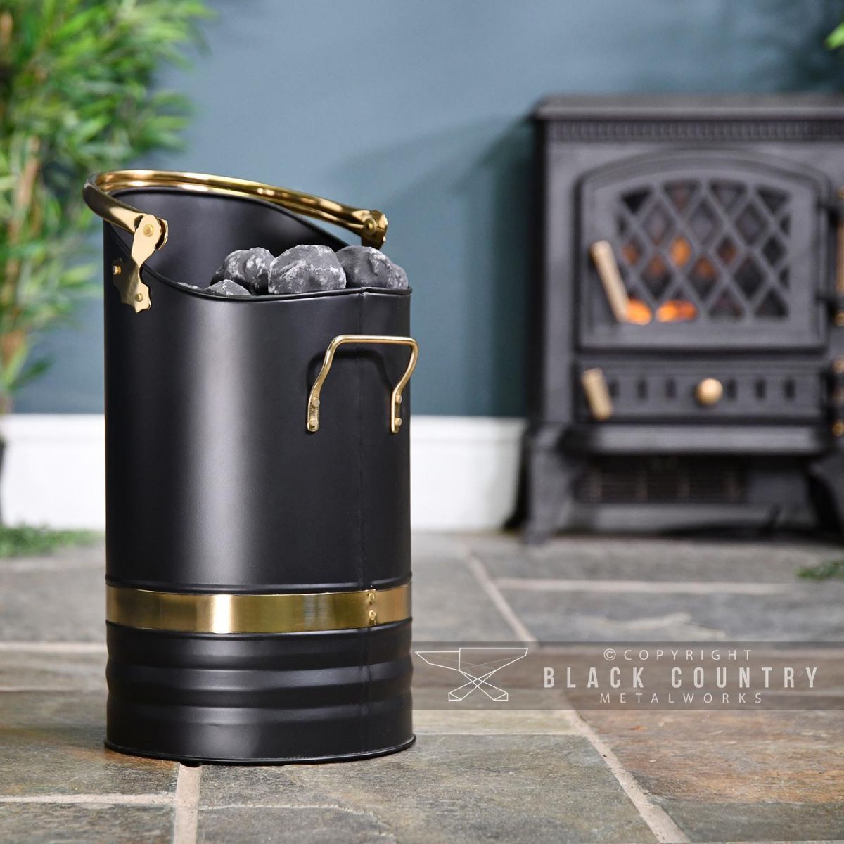 Contemporary Black Coal Hod With Brass Handles in Situ Next to the Fire Place Contemporary Black Coal Hod With Brass Handles in Situ Next to the Fire Place