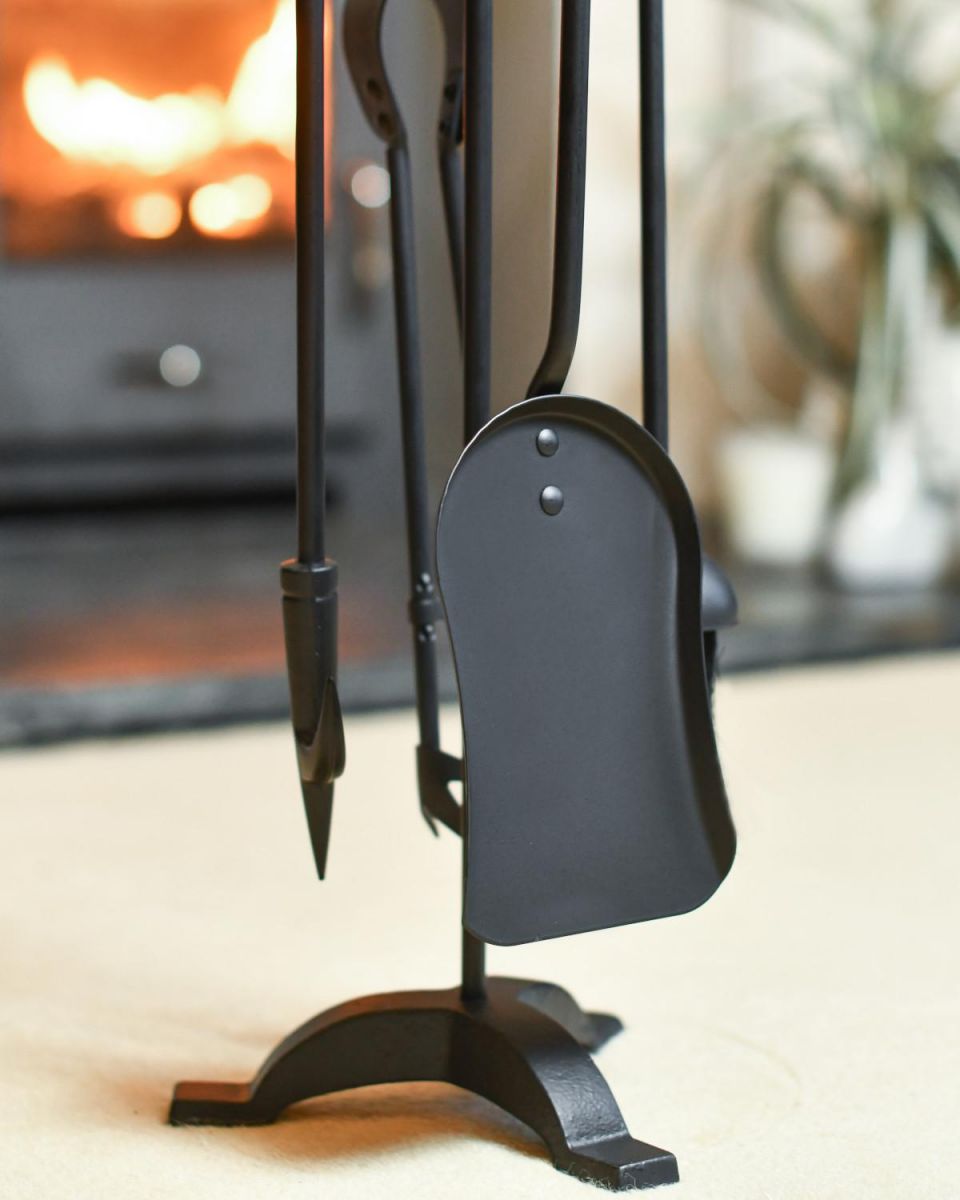 Close-Up of Contemporary Black "Tripod" Four Piece Companion Set