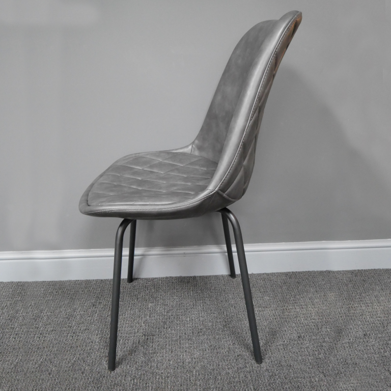 View of the Side of the Grey Leather Dining Chair