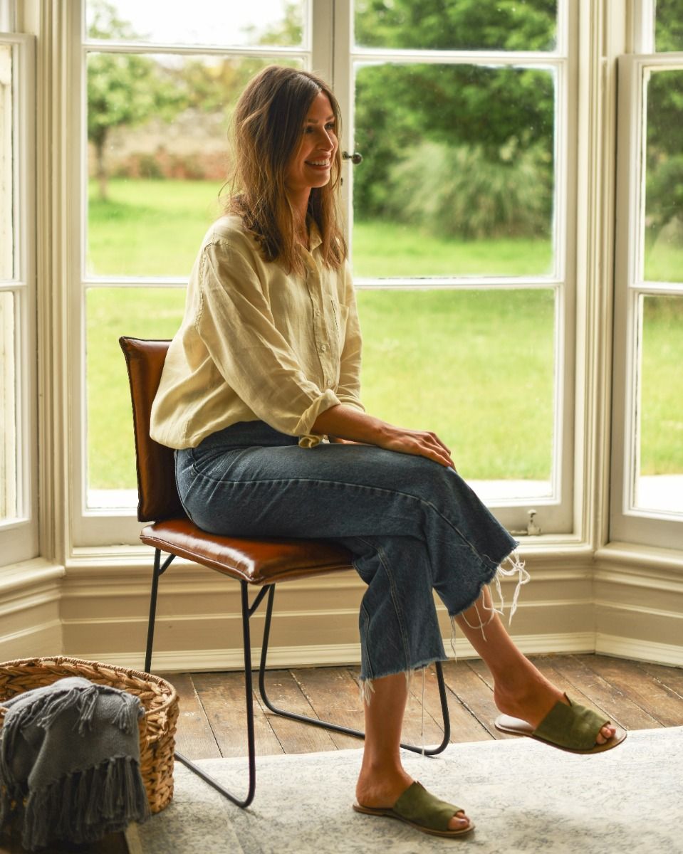Contemporary Tan Leather and Black Steel Chair with a Person sat down for Scale