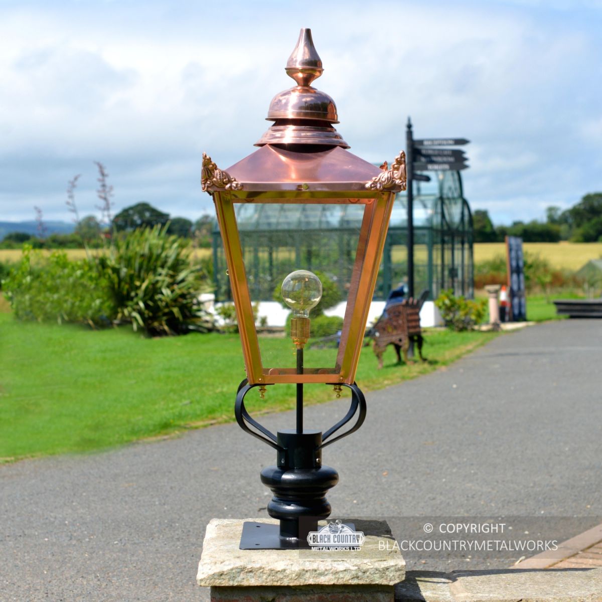 Copper Victorian Pillar Light and Lantern Set on a Brick Pillar