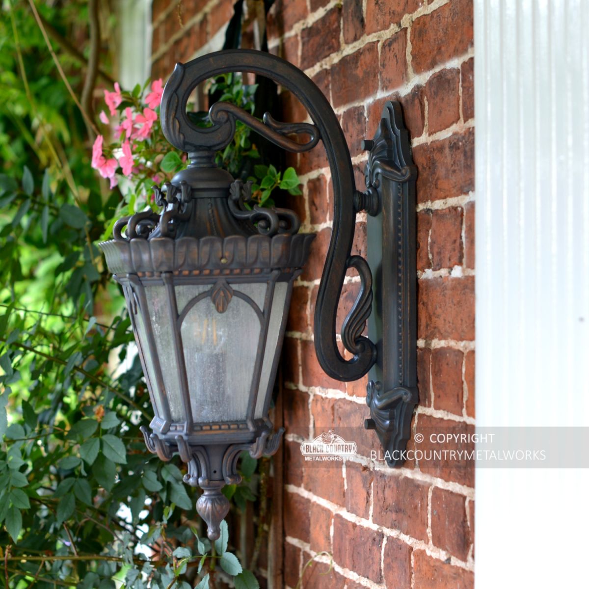 Side view of the "Cotsworld Collection" Ornate Top Fix Wall Lantern