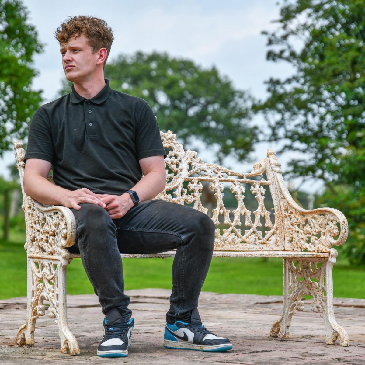 Male sat on Antique Cream Gothic Bench for Scale 