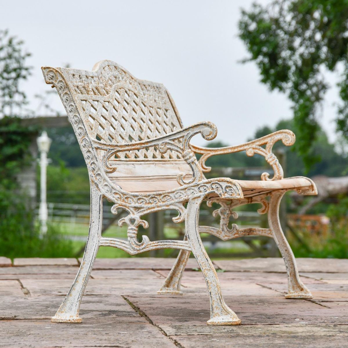 Side view of "Rose Lattice" Garden Bench in Antique Cream Finish