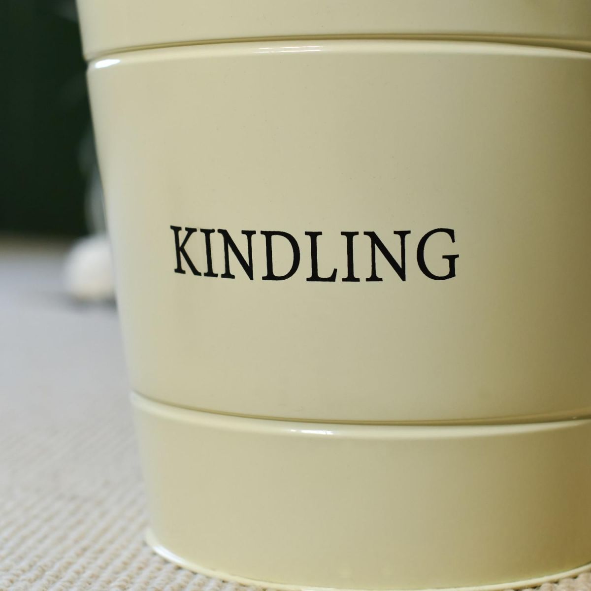 Close-Up of "KINDLING" Text on Log Store Bucket Close-Up of "KINDLING" Text on Log Store Bucket
