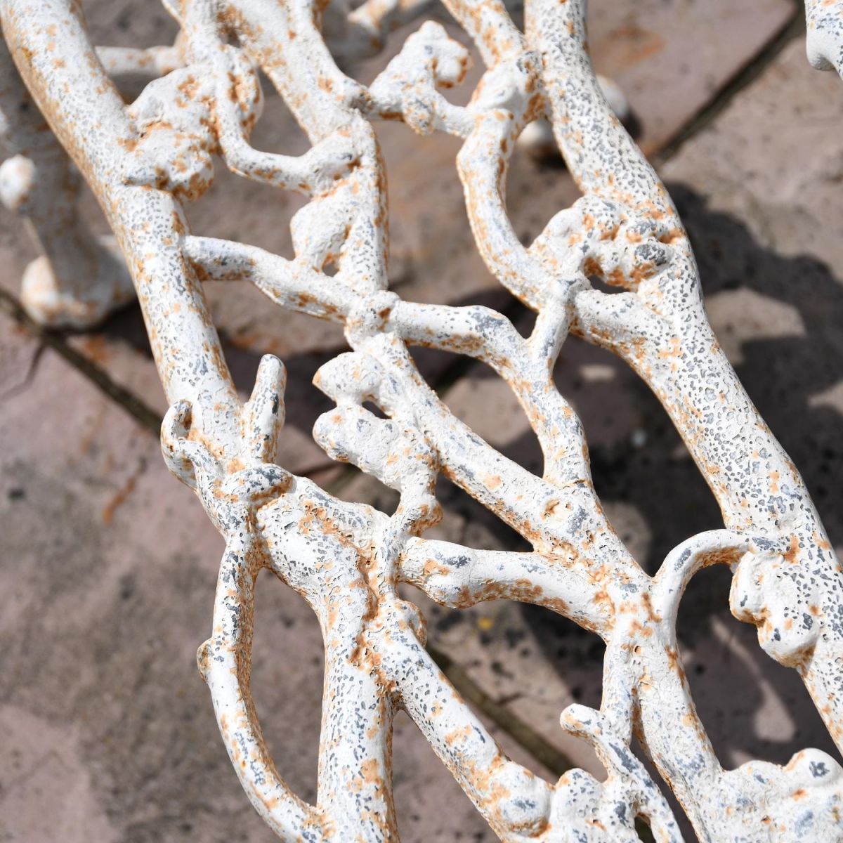 Close up of Antique Cream Tree Branch Bench detailing