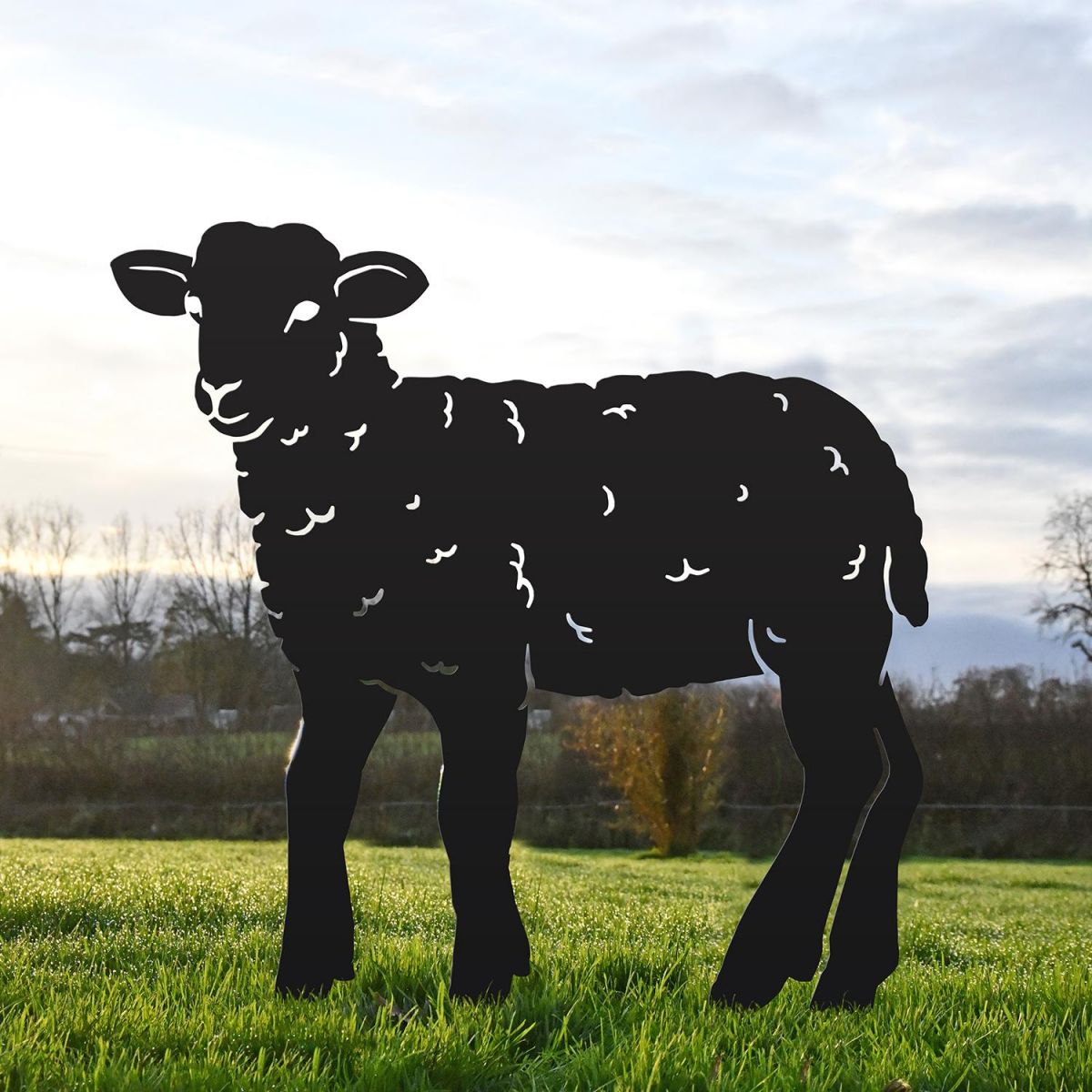 Black Iron Curly Lamb Silhouette in Situ in the Garden