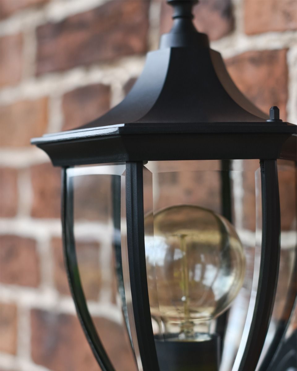 Close up of Curved Lantern with Clear Glass Showing Bulb 
