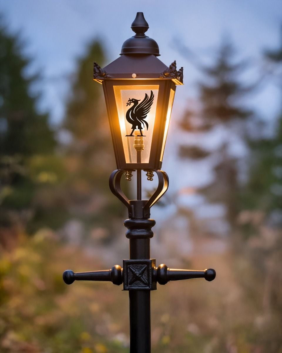 Custom Liver Bird Design Victorian Garden Lamp Post Positioned in Front of a Forest Backdrop