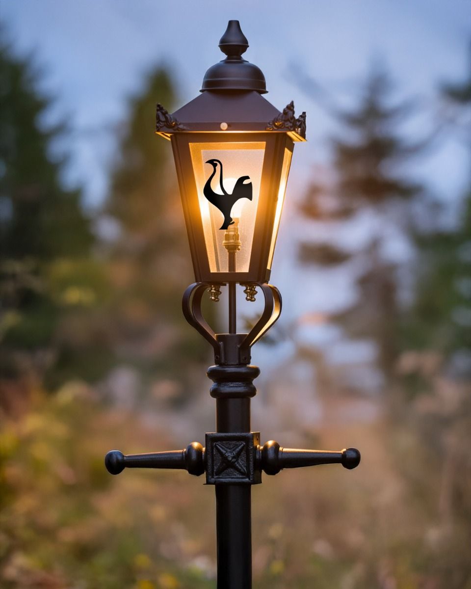 Custom Modern Rooster Design Victorian Garden Lamp Post Positioned in Front of a Forest Backdrop