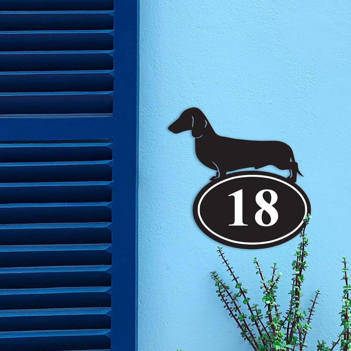 Dachshund Iron House Number Sign in Situ on a Blue Wall 
