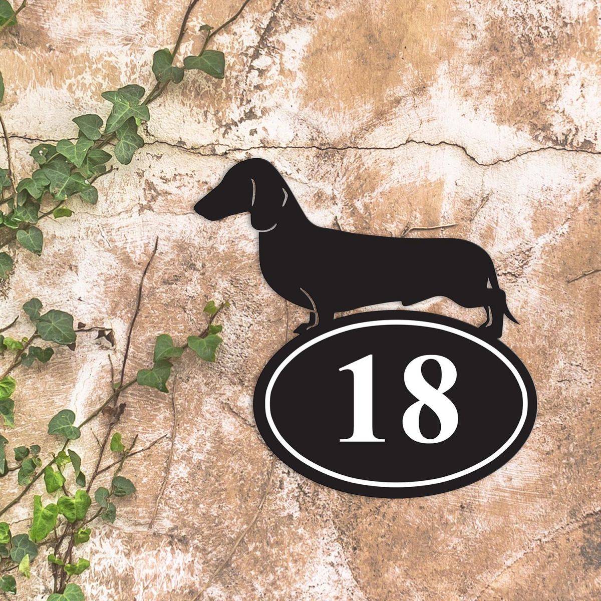 Dachshund Iron House Number Sign in Situ on a Rustic Wall 