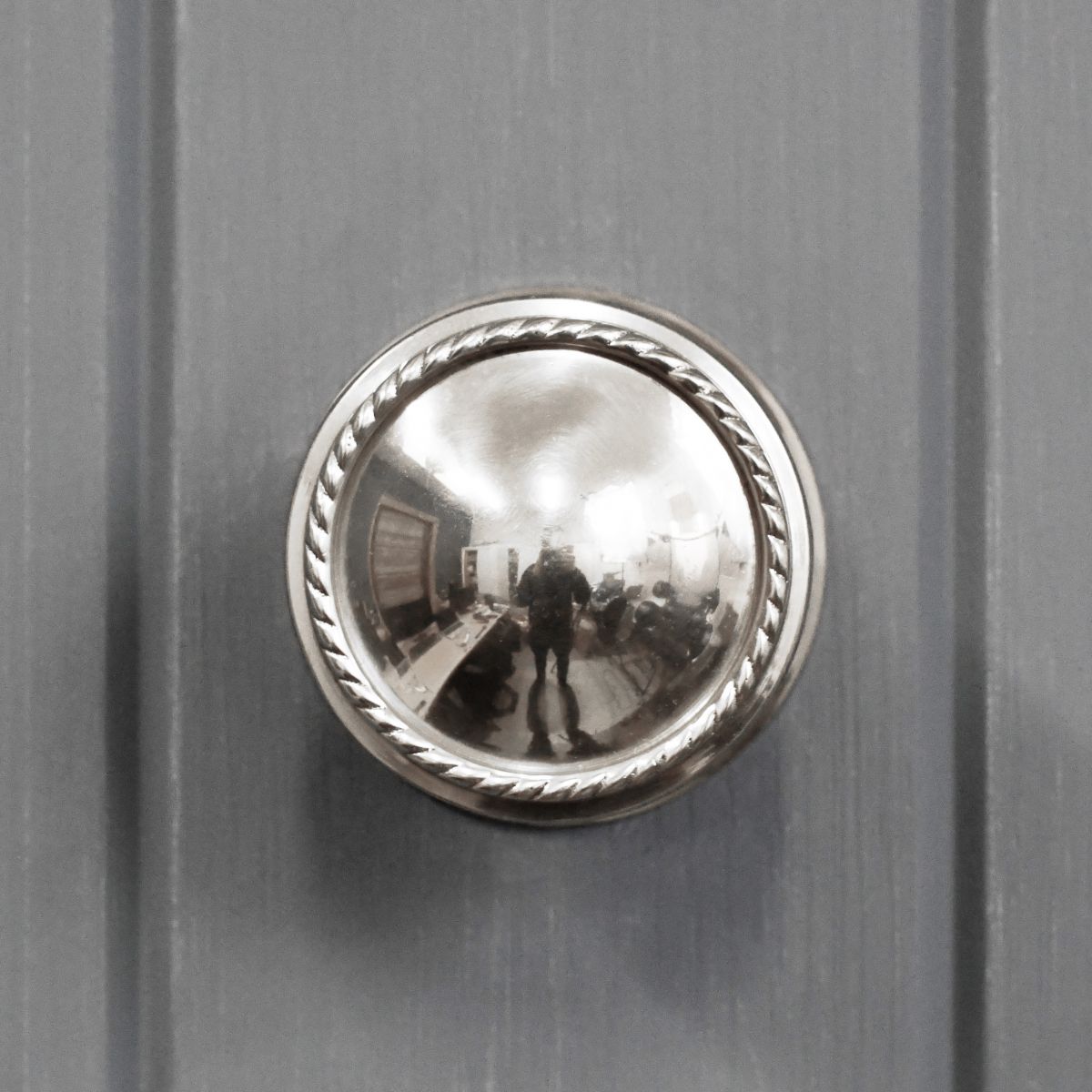 Exterior door centre door knob finished in bright chrome