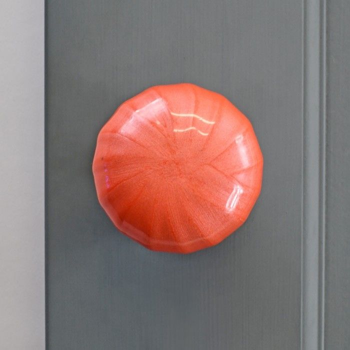 "Sunrise Orange" Hand Finished Ceramic Door Knob on a Grey Door