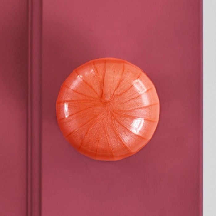 "Sunrise Orange" Hand Finished Ceramic Door Knob on a Pink Door
