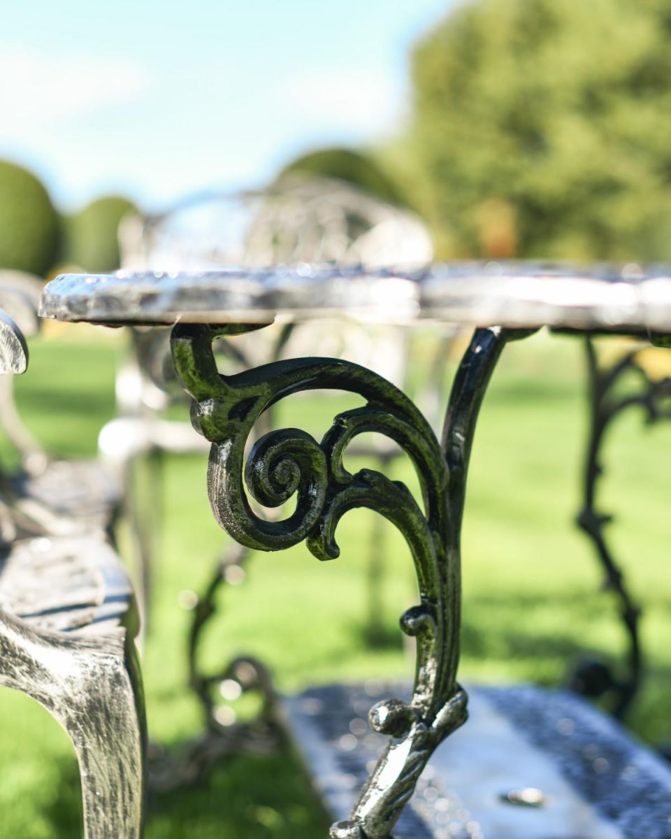 Close-Up of Ornate Leg Supports for Table 