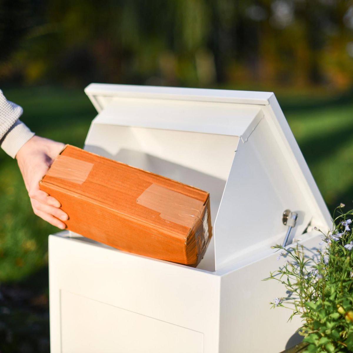 Lid Opening in Use on Deluxe White "Bexley" Free Standing Parcel Box Lid Opening in Use on Deluxe White "Bexley" Free Standing Parcel Box