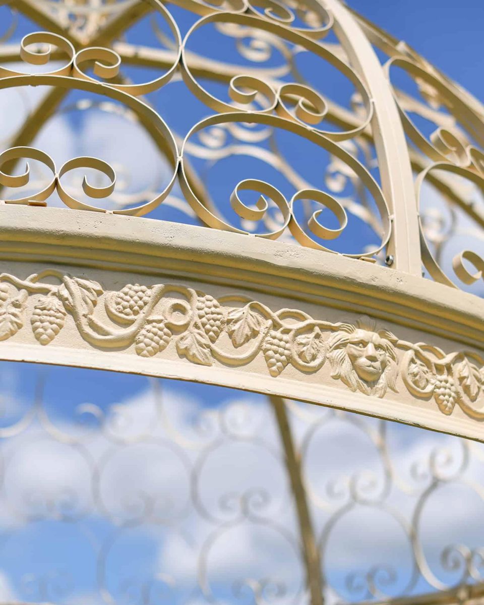 Close-Up of Pattern on Deluxe Wrought Iron "Aurelia" French Cream Gazebo Close-Up of Pattern on Deluxe Wrought Iron "Aurelia" French Cream Gazebo