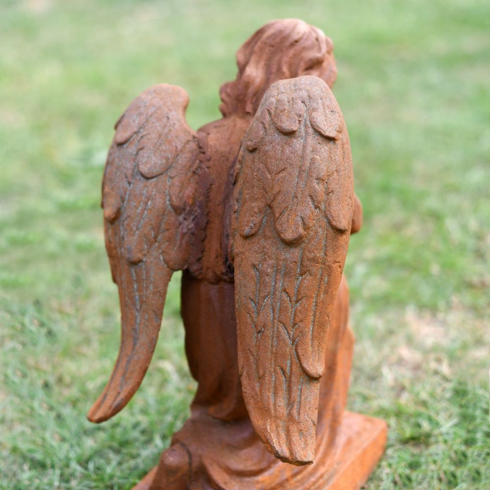 Detail in the Feathers of the Praying Angel Statue Detail in the Feathers of the Praying Angel Statue