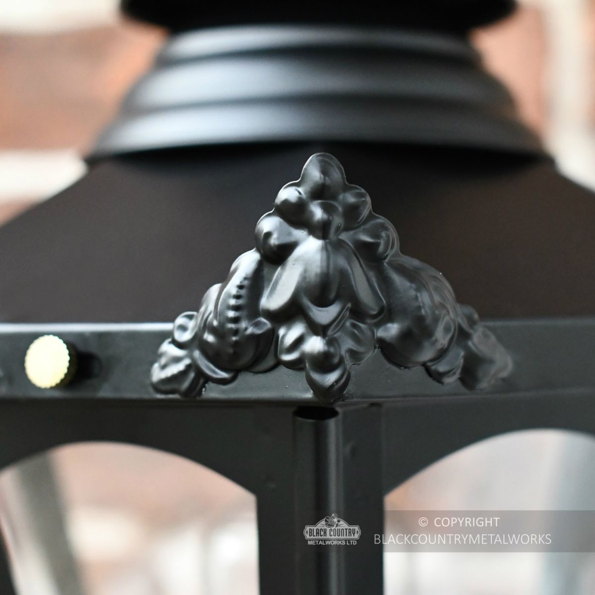Detailed image of Victorian corner finial on hexagonal wall lantern