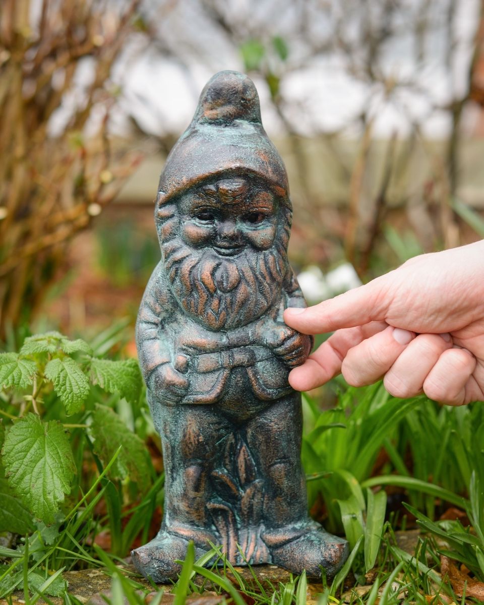 Digital illustation of ‘Podge’ the Small Garden Gnome in Cast Aluminium - Verdigris with hand in shot for scale