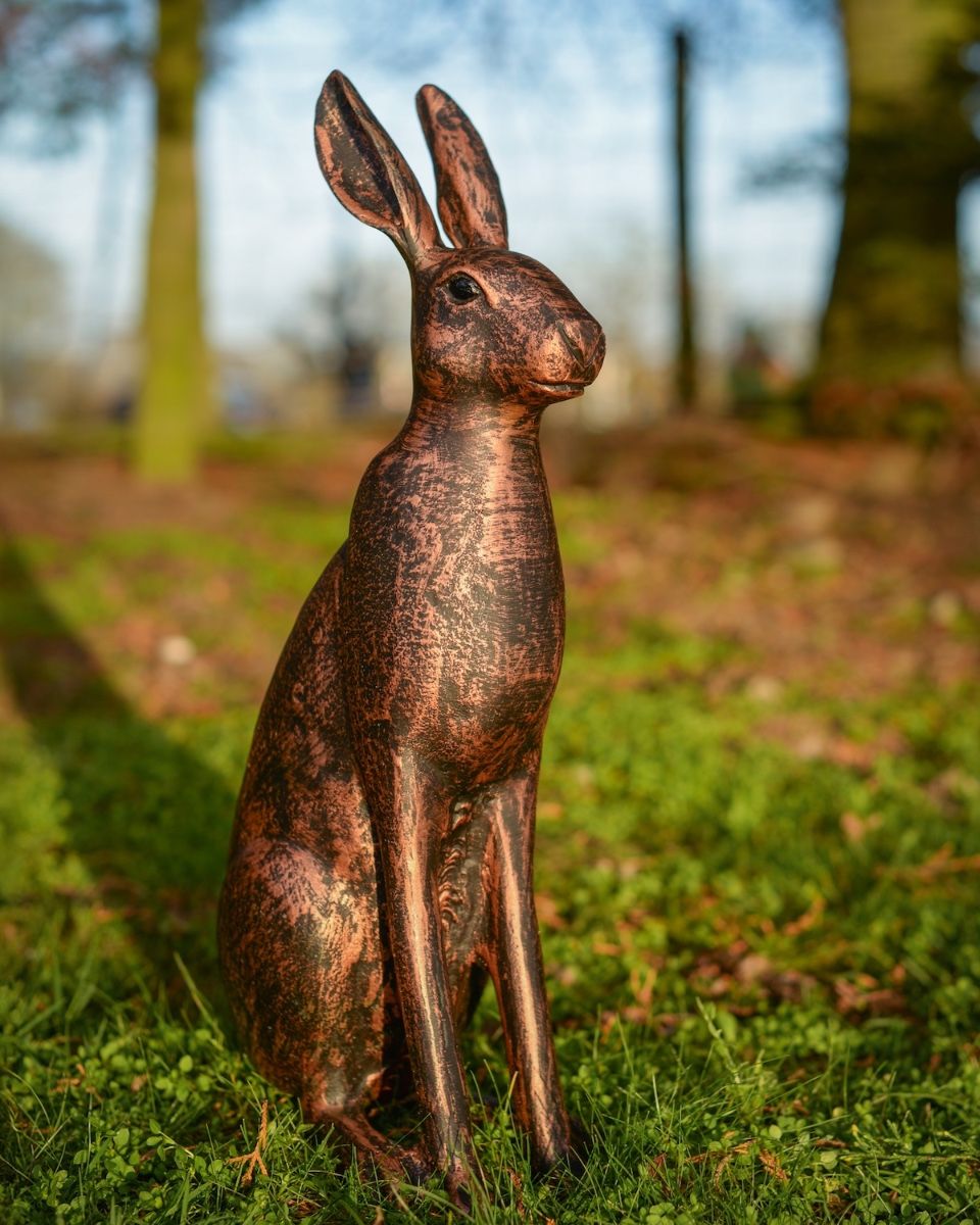 Digital illustration of a Copper ‘Blossom’ the Cast Aluminium Rabbit Garden Sculpture positioned in a woodland scene