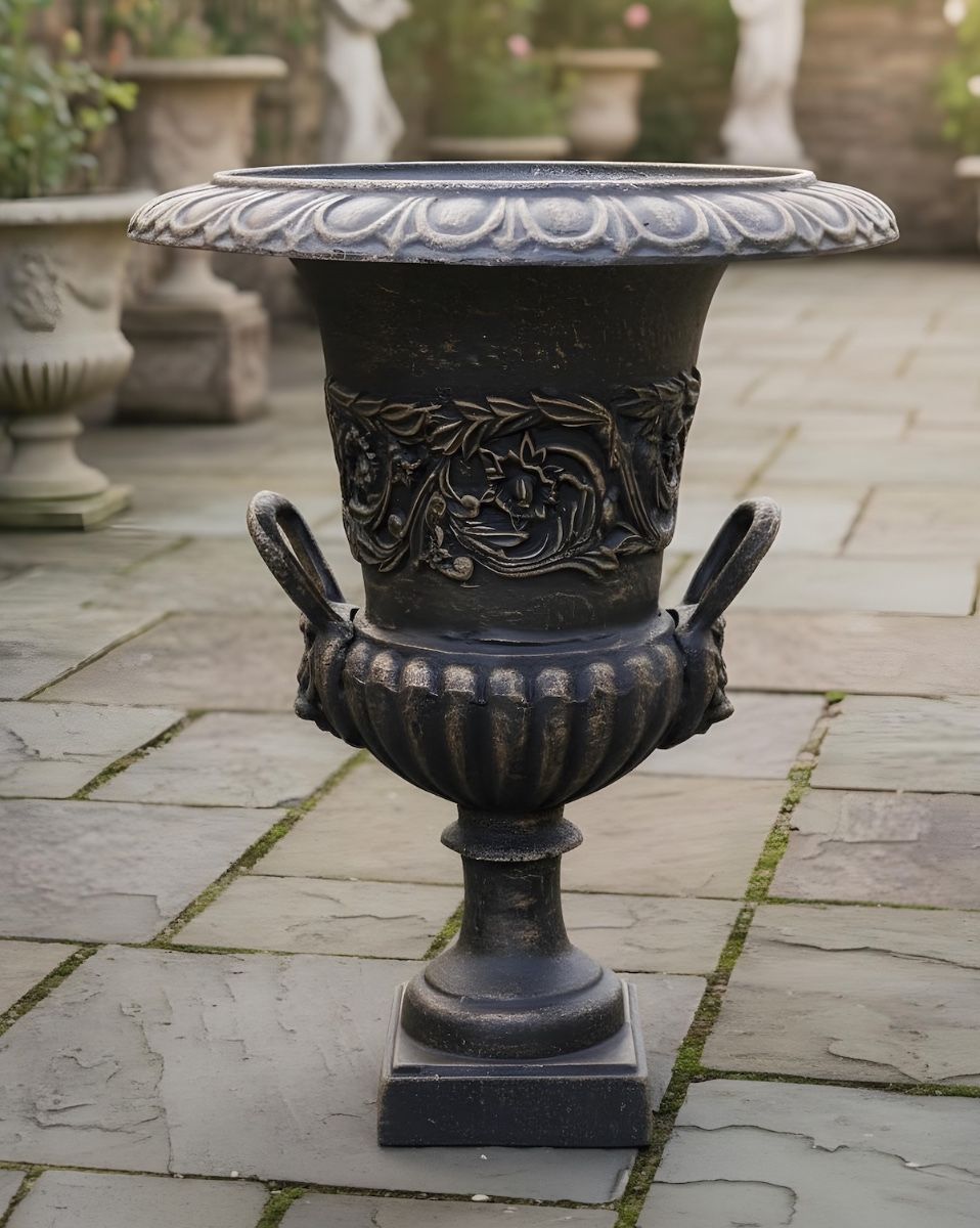 Digital illustration of Cast Iron Bronze Urn positioned in front of garden planters and sculptures