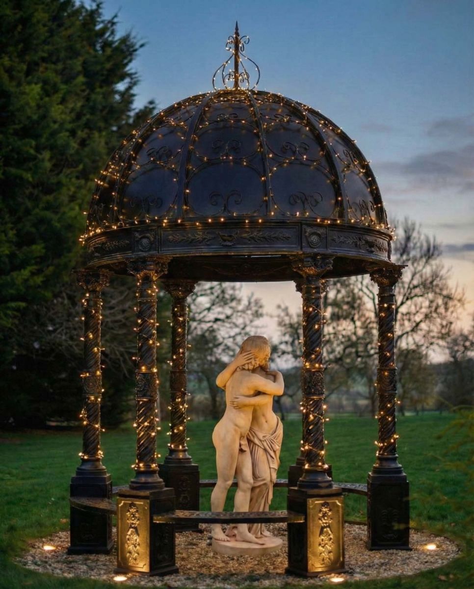 Digital illustration of Deluxe Wrought Iron "Amelia" Black Powder Coated Gazebo lit up at night