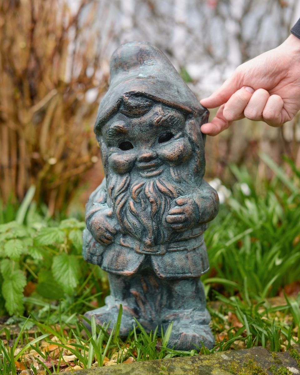 Digital illustration of ‘Hodge’ the Garden Gnome in Cast Aluminium - Verdigris with hand in shot for scale