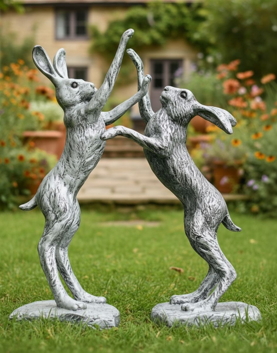 Digital illustration of Pewter Boxing Hares Sculpture on a Garden Lawn