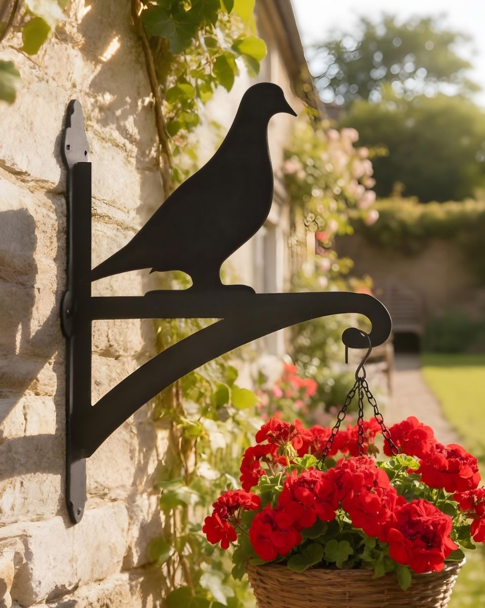 Digital illustration of Pigeon Hanging Iron Basket Bracket mounted on a garden cottage