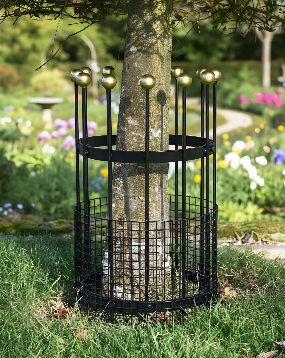 Digital illustration of small black and gold finish tree guard at base of a tree