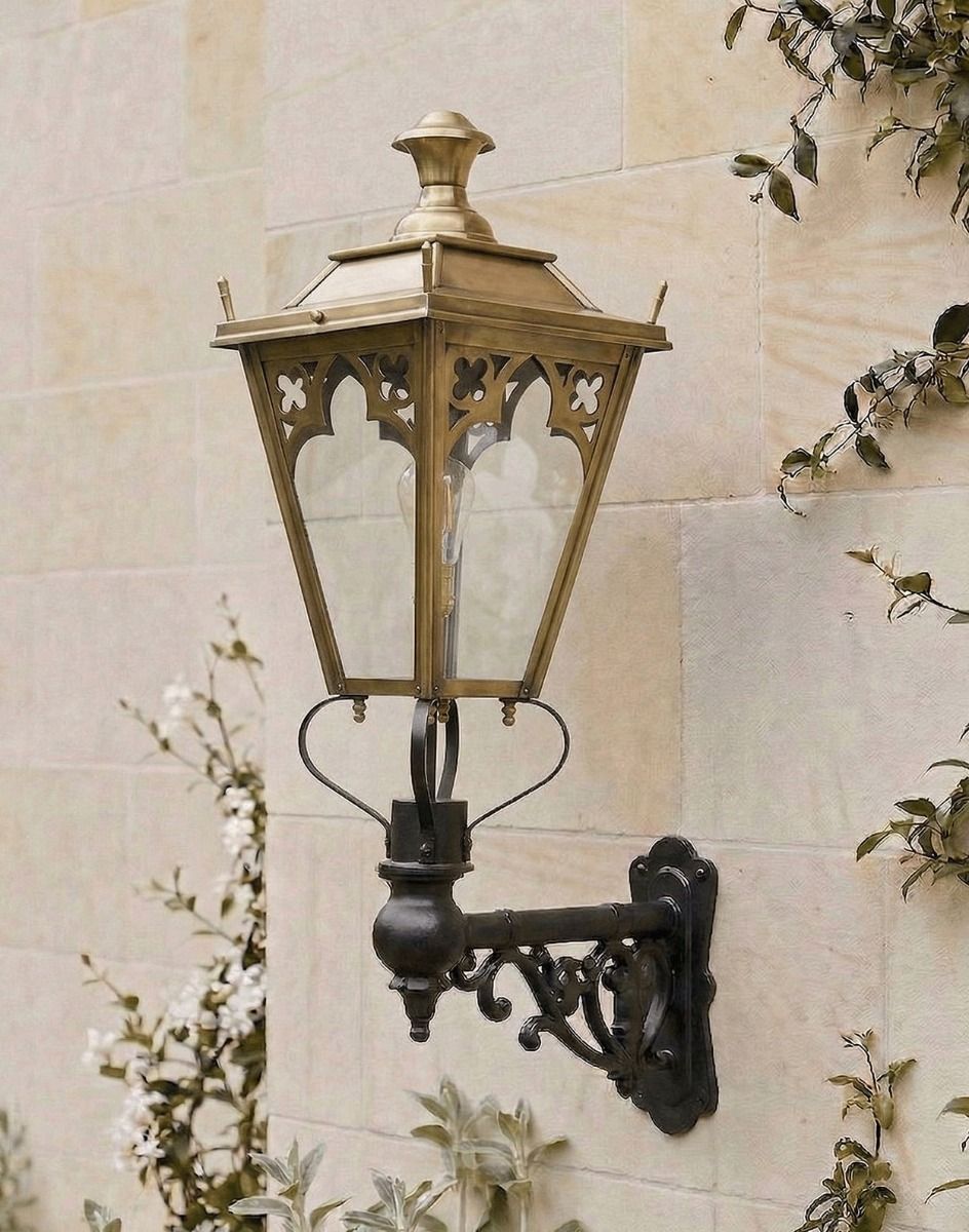 Digital Illustration of the 102 x 54cm Brass Gothic Wall Lantern on an Ornate Bracket Mounted on a Sandstone Brick Garden Wall