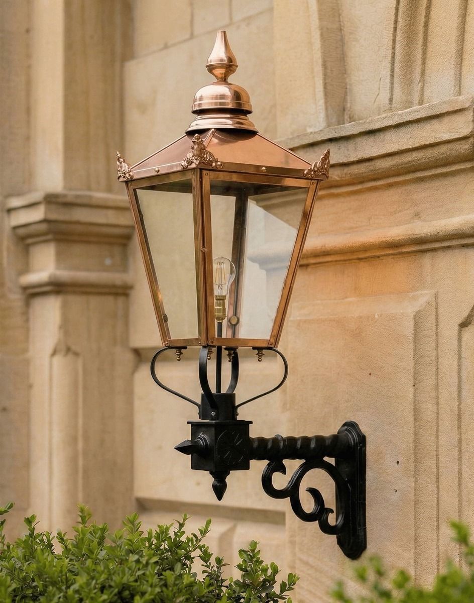 Digital Illustration of the 115 x 51cm Copper Wall Lantern on a Royale Bracket Mounted on a Sandstone Brick Building Entanceway