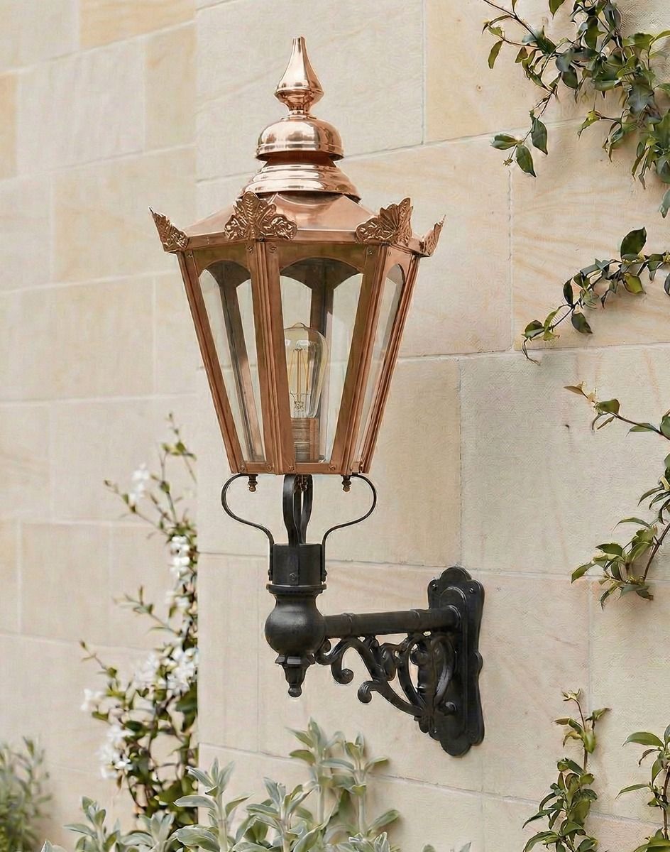Digital Illustration of the 115 x 53cm Copper Hexagonal Wall Lantern on an Ornate Bracket Mounted on a Sandstone Brick Garden Wall