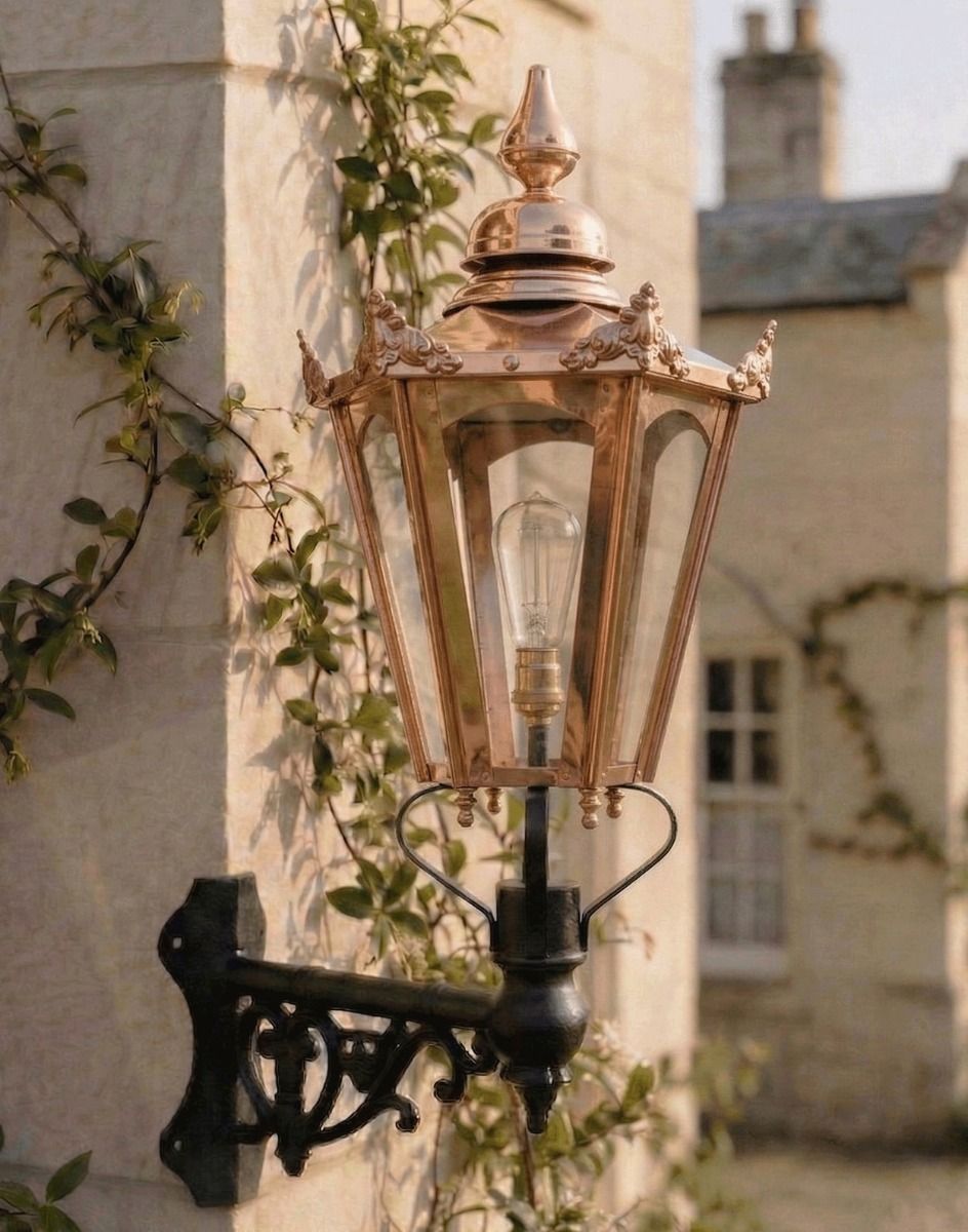 Digital Illustration of the 115 x 53cm Copper Hexagonal Wall Lantern on Corner Bracket Mounted on a Sandstone Brick Wall Building 