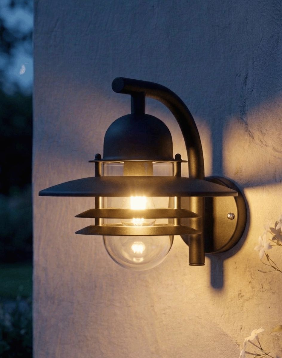 Digital Illustration of the "Chesil" Modern Overhanging Wall Light in Black Lit up at Night