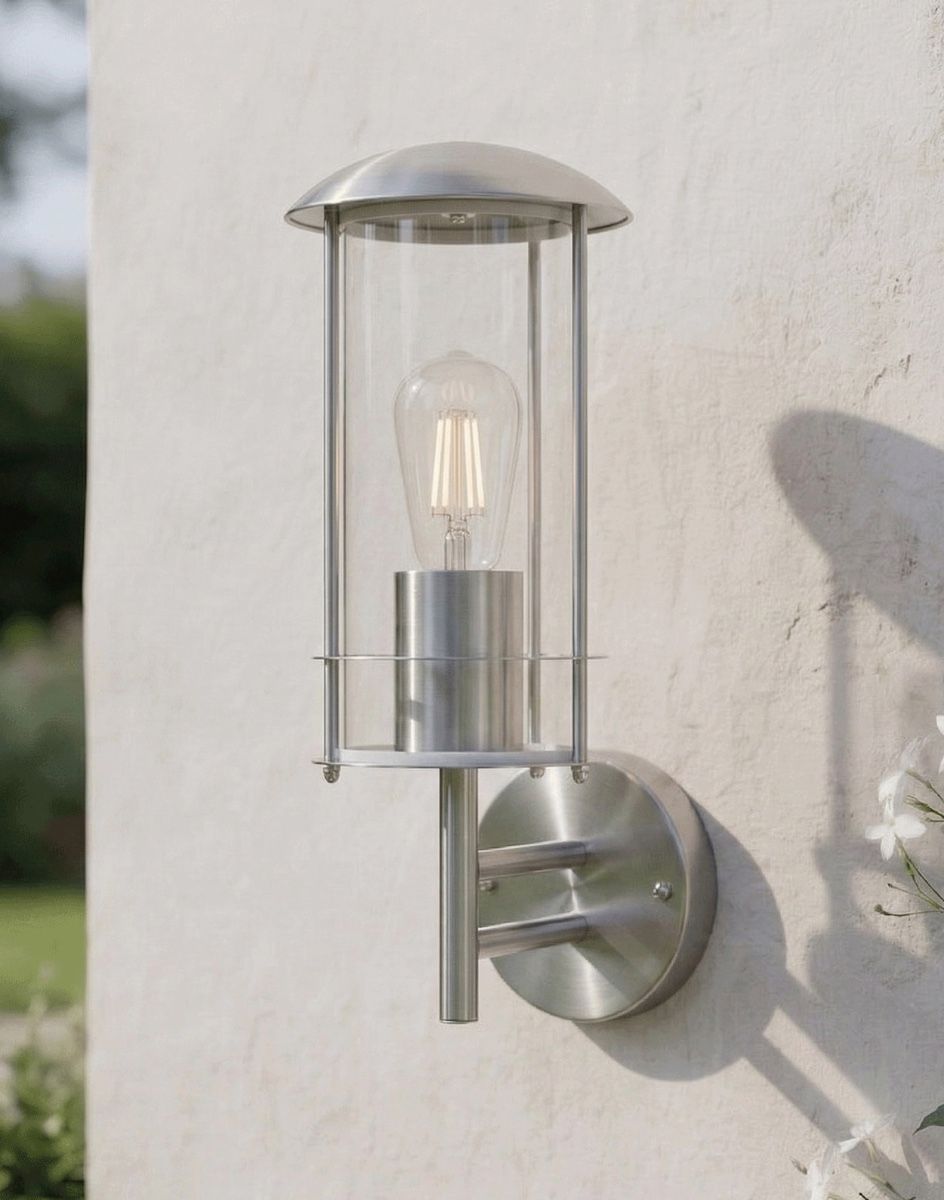 Digital Illustration of the "Pello" Contemporary Stainless Steel Wall Lantern Positioned on a White Garden Wall in the Afternoon Sun