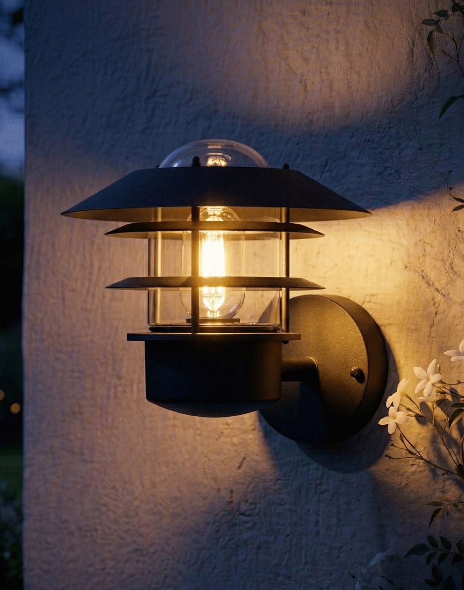 Digital Illustration of the "Skive" Contemporary Wall Light in Black Lit up at Night