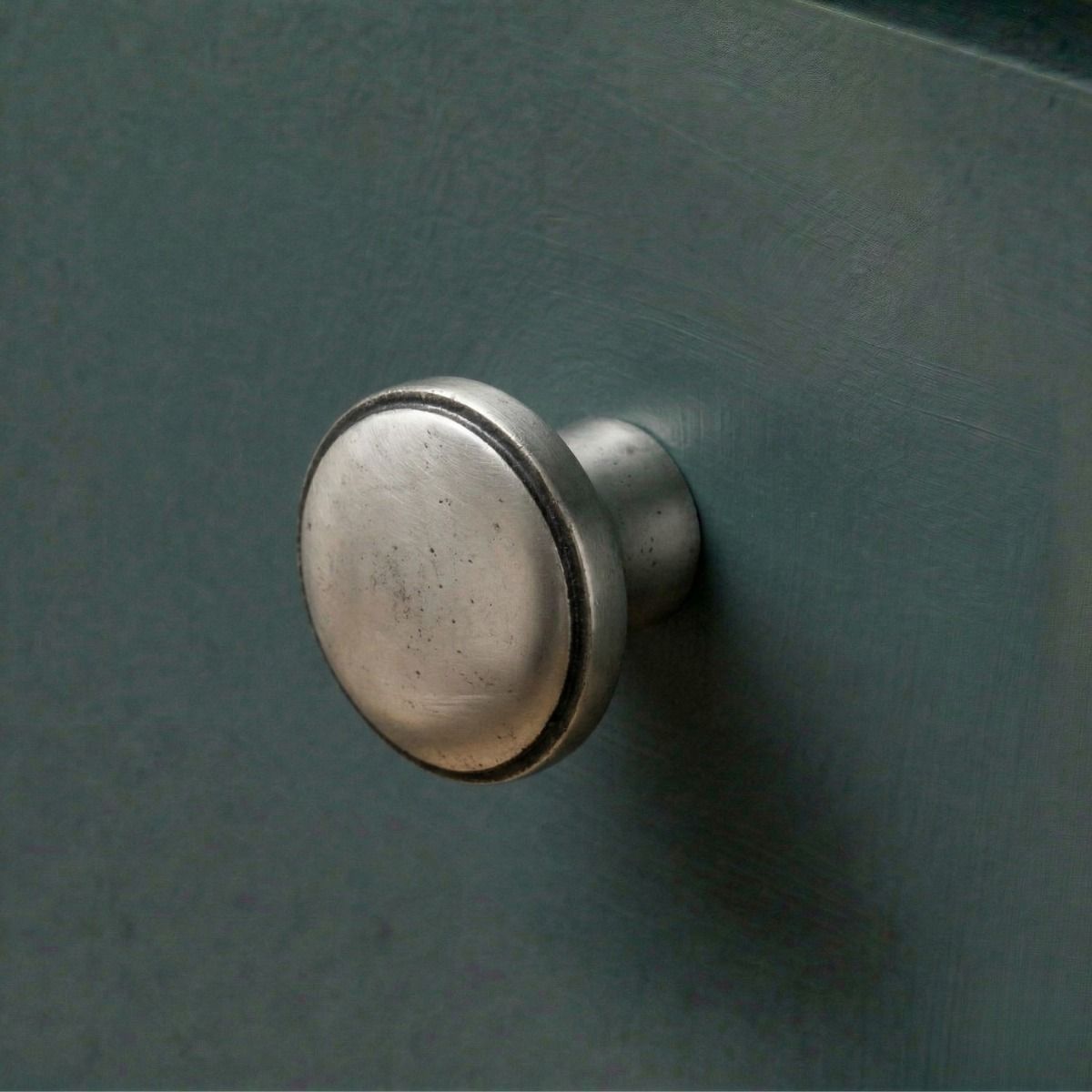 Digital Illustration of the 32mm Natural Cast Iron Cabinet Knob Mounted on a Blue Kitchen Cupboard