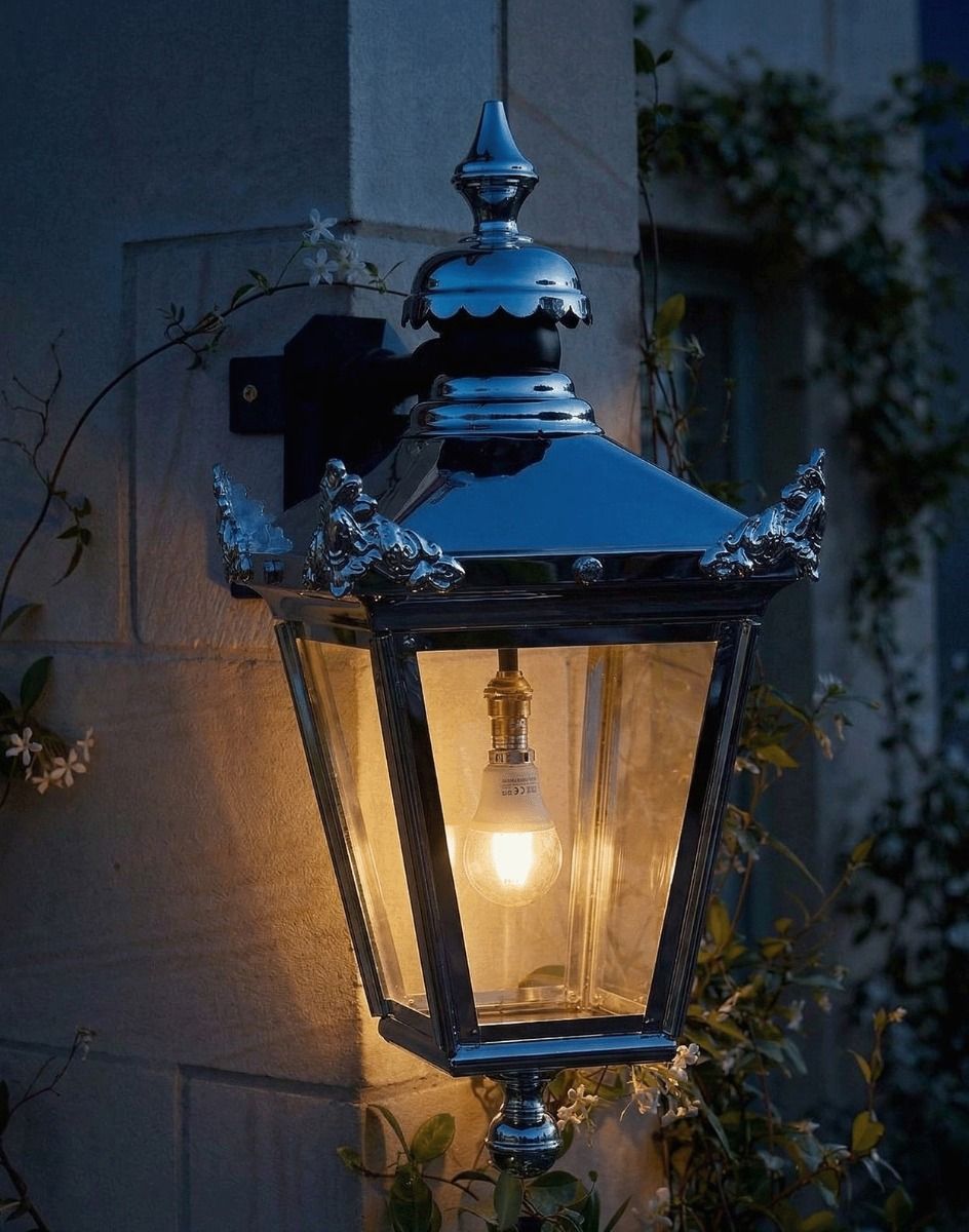 Digital Illustration of the 63 x 47.5cm Bright Chrome Suspended Corner Wall Lantern Lit up at Night