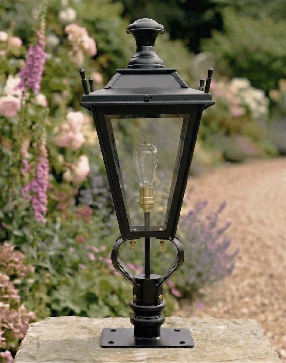 Digital Illustration of the 71cm Black Dorchester Pillar Light and Lantern Set Mounted on a Stone Garden Pillar Surrounded by Flowers Viewed Face on