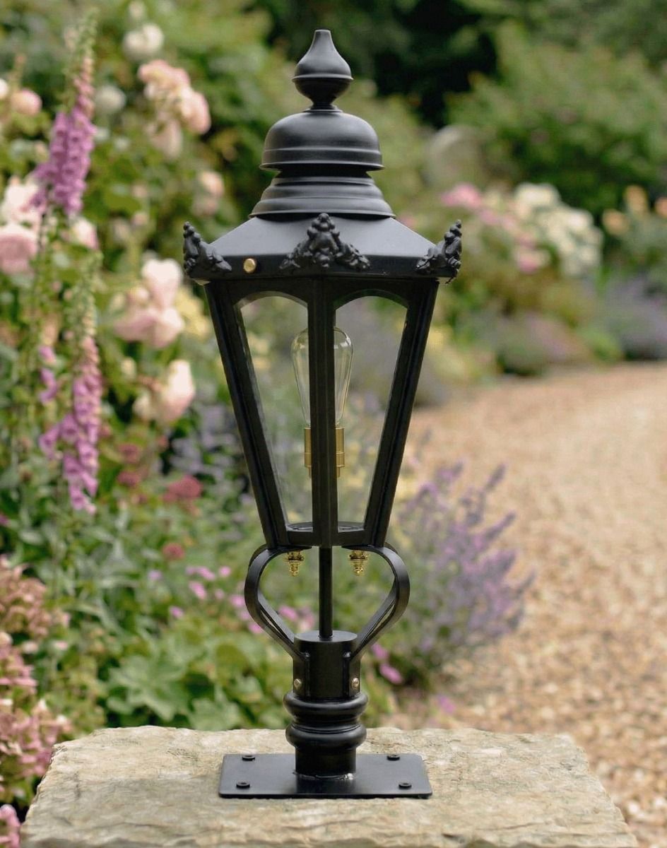 Digital Illustration of the 76cm Black Hexagonal Pillar Light and Lantern Set Mounted on a Stone Pillar in a Garden Viewed from an Angle