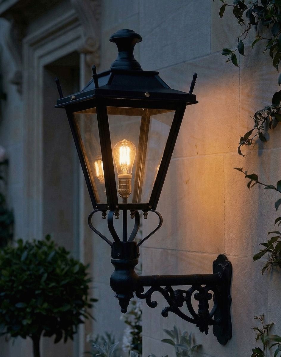 Digital Illustration of the 84 x 37cm Black Dorchester Wall Lantern on Ornate Bracket Lit up at Night 