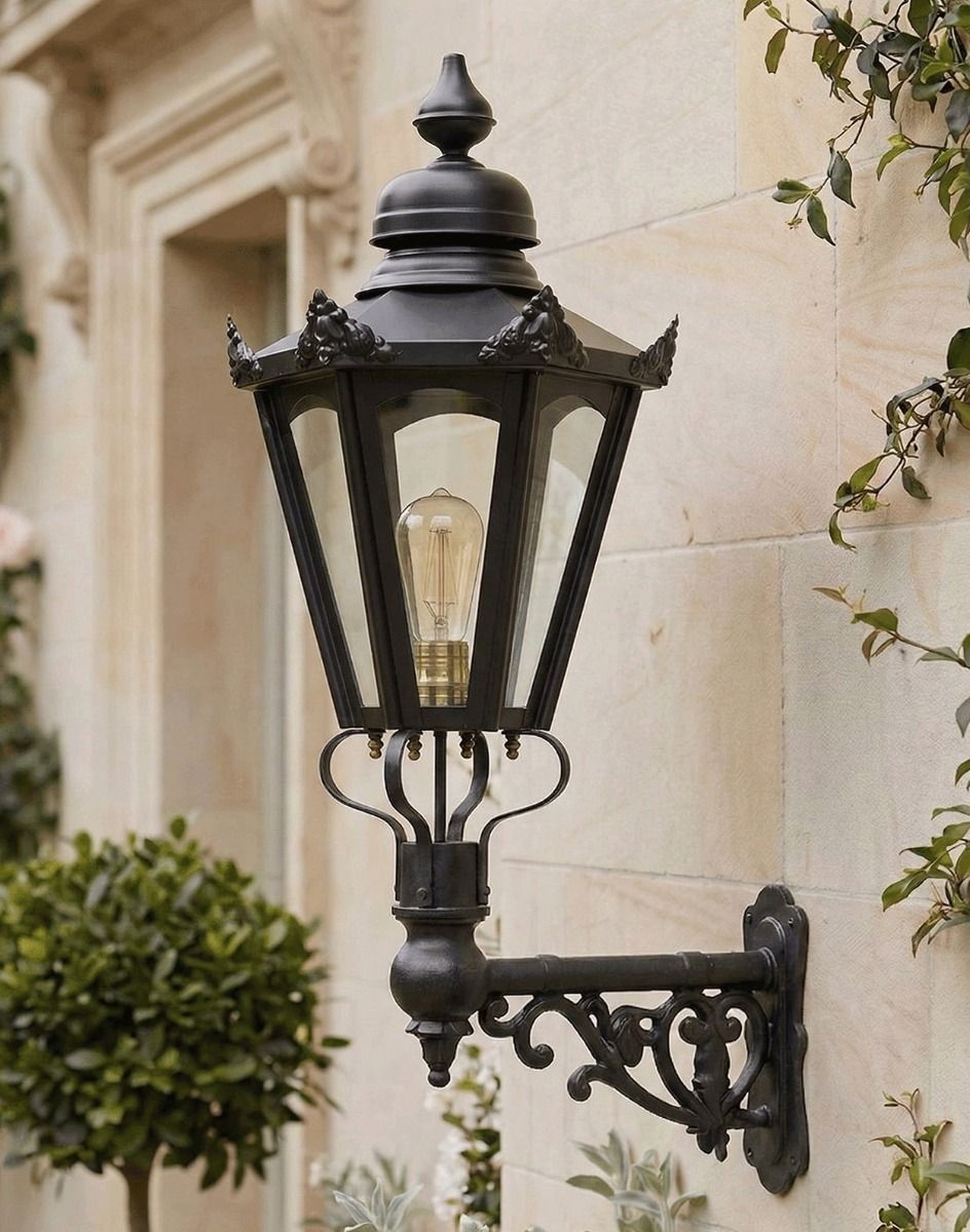 Digital Illustration of the 88 x 33cm Black Hexagonal Wall Lantern on Ornate Bracket Mounted on a Premium Property Entrance