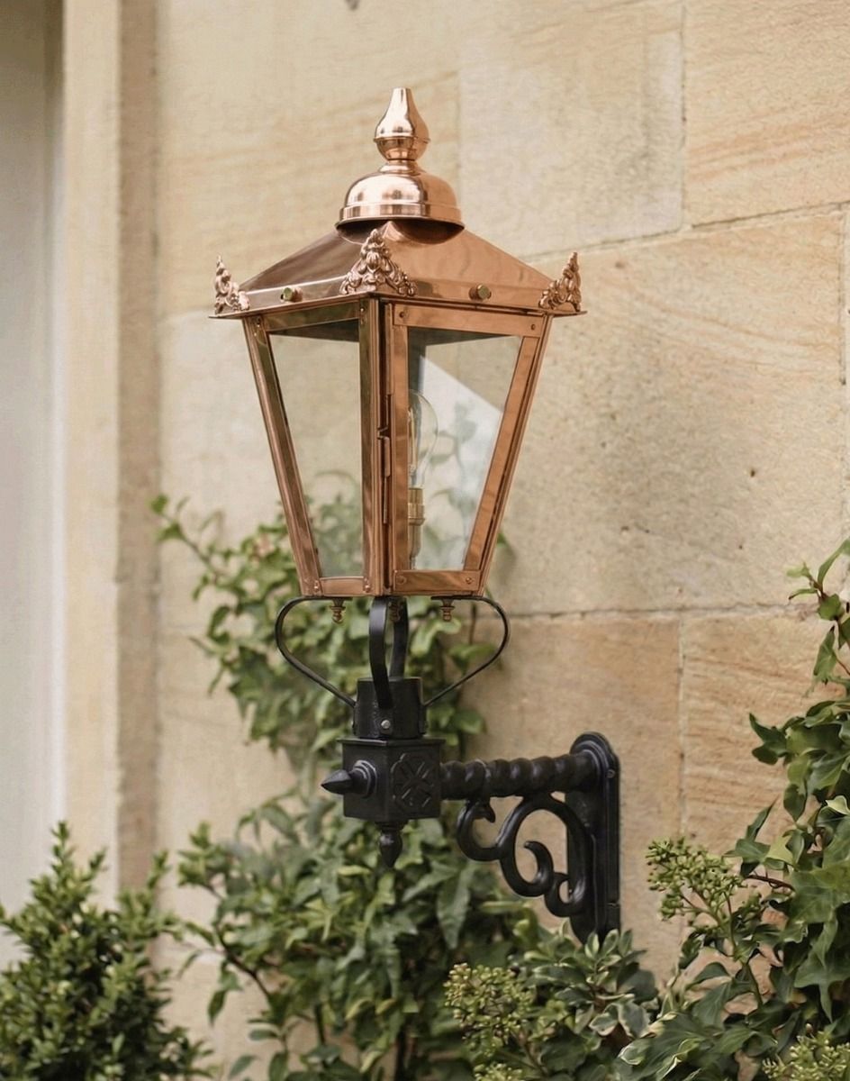 Digital Illustration of the 88 x 33cm Copper Wall Lantern on a Royale Bracket Mounted on a Sandstone Brick Building