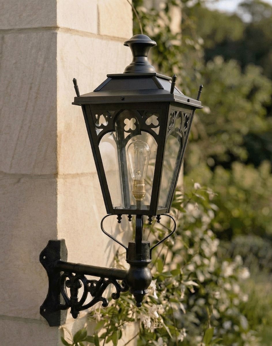 Digital Illustration of the 95 x 48cm Black Gothic Wall Lantern on a Corner Bracket Mounted on a Sandstone Brick Garden Building