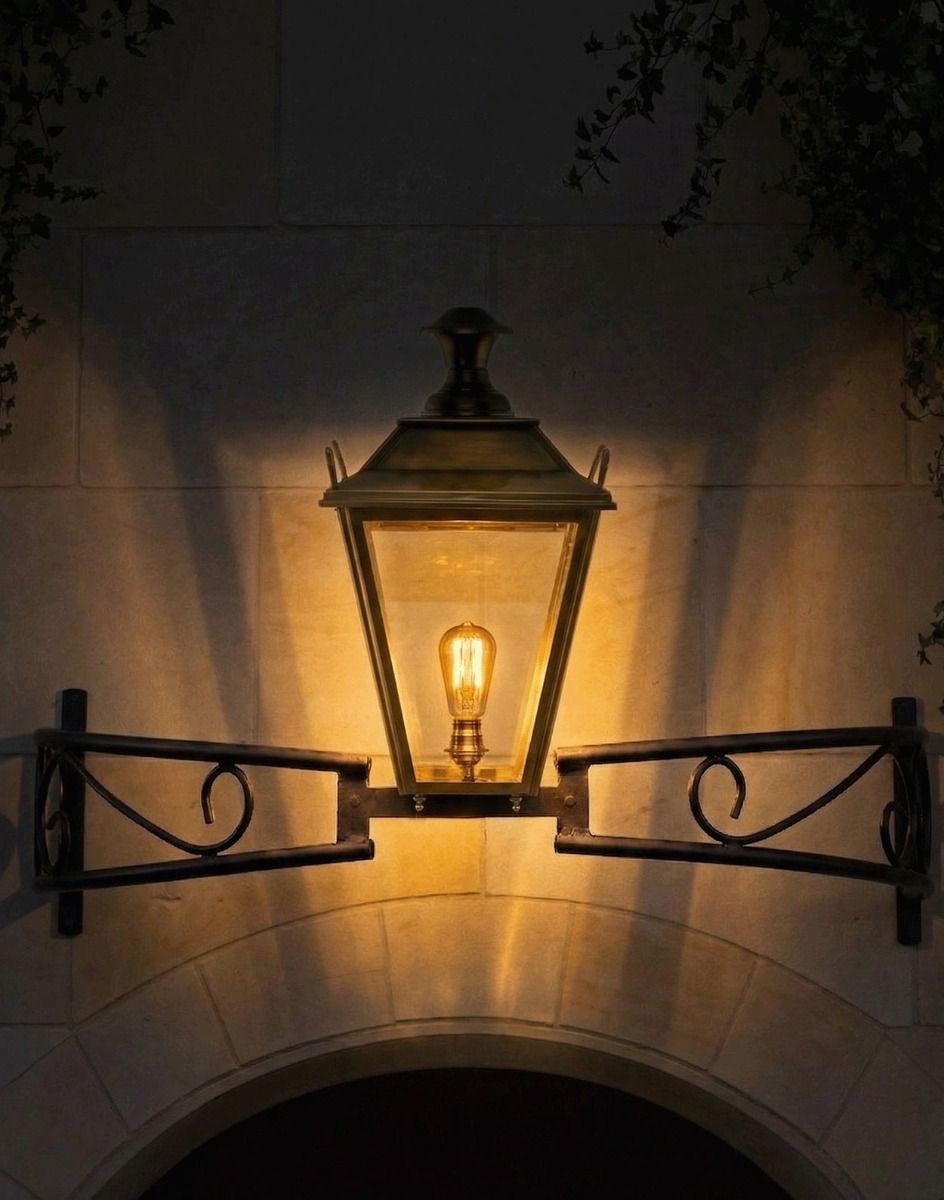 Digital Illustration of the Antique Brass Dorchester Bow Bracket Light Lit up at Night