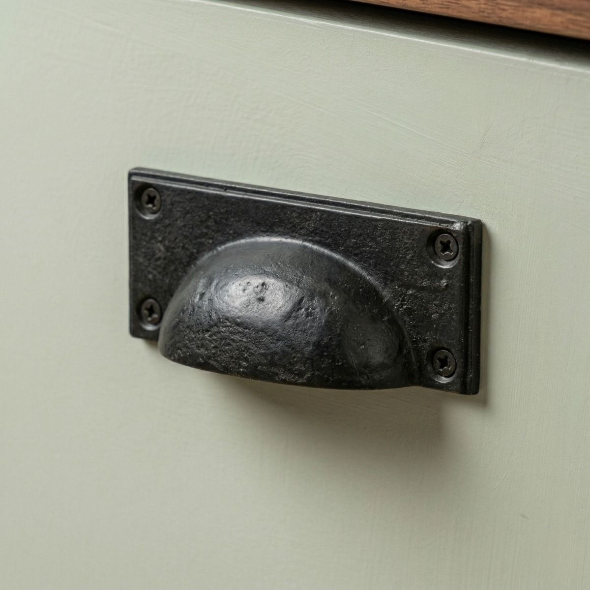 Digital Illustration of the Beeswax Rectangular Drawer Pull with Curved Handle Mounted on a Green Cupboard Door