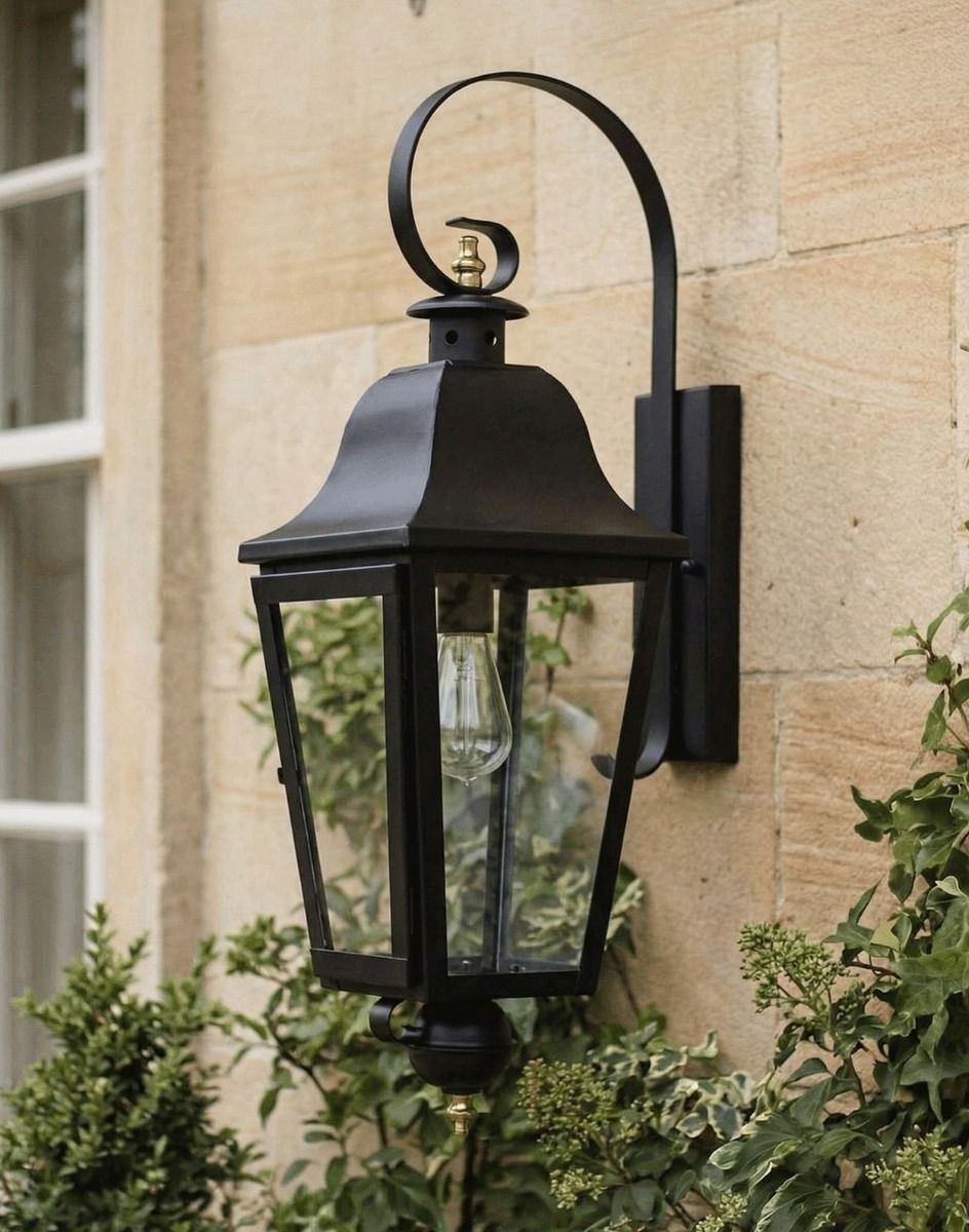 Digital Illustration of the Black "Cleobury" Wall Lantern Mounted on a Cream Coloured Exterior Wall
